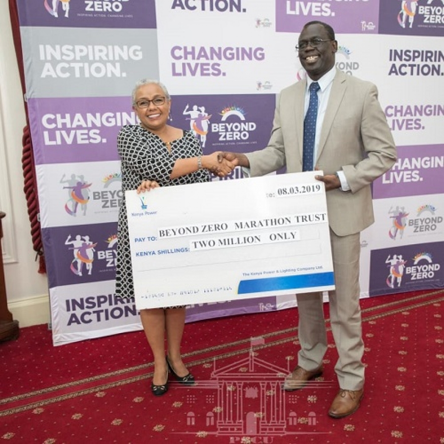Ag.MD & CEO Eng. Jared Othieno presents a cheque of kshs. 2M sponsorship towards #BeyondZeroCampaign.
